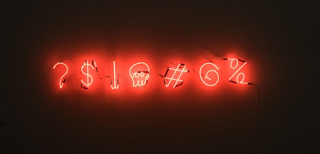 Symbols captured in red neon lights