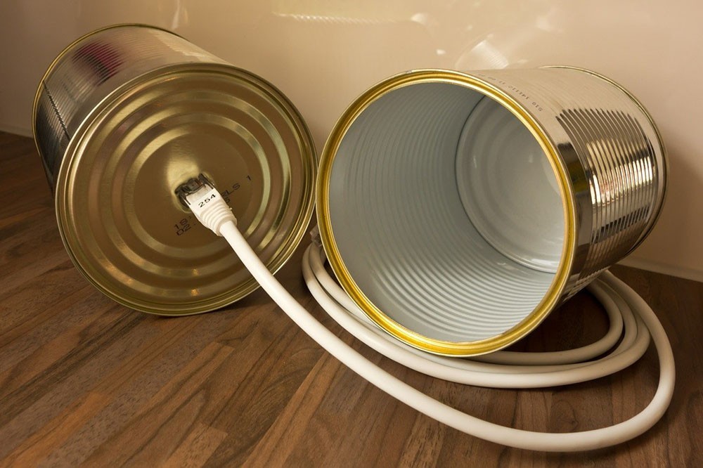 Tin can phone with ethernet cable symbolizing Voice over Internet Protocol, VoIP